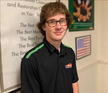 Male SERVPRO employee with glasses