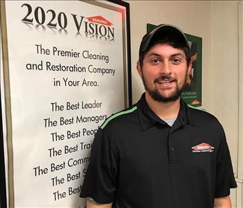 SERVPRO tech with beard in front of white wall