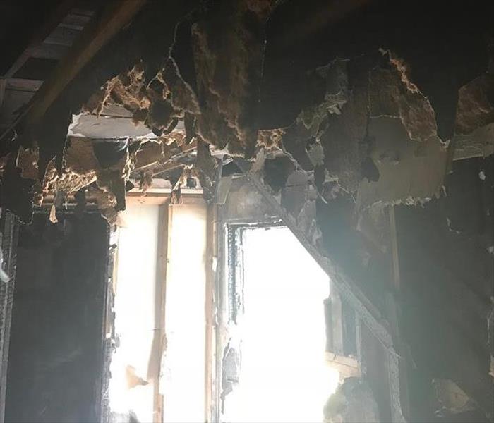 dark roof falling in after a fire
